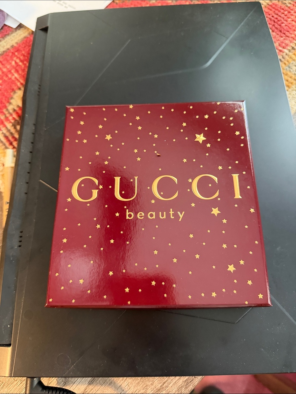 Gucci Beauty Box with 3 lipsticks and a lip gloss. New in box.  Red colors.